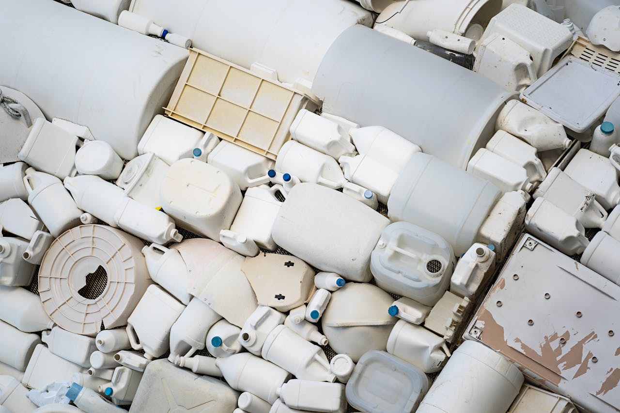 A pile of assorted recyclable plastic containers highlighting the issue of plastic waste.